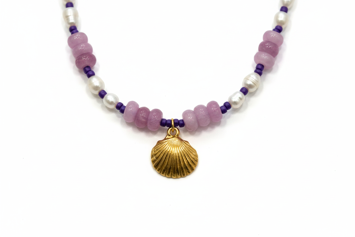 Close-up of gold shell charm