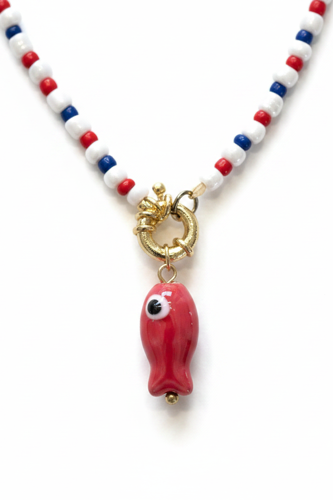 Closeup of red fish charm