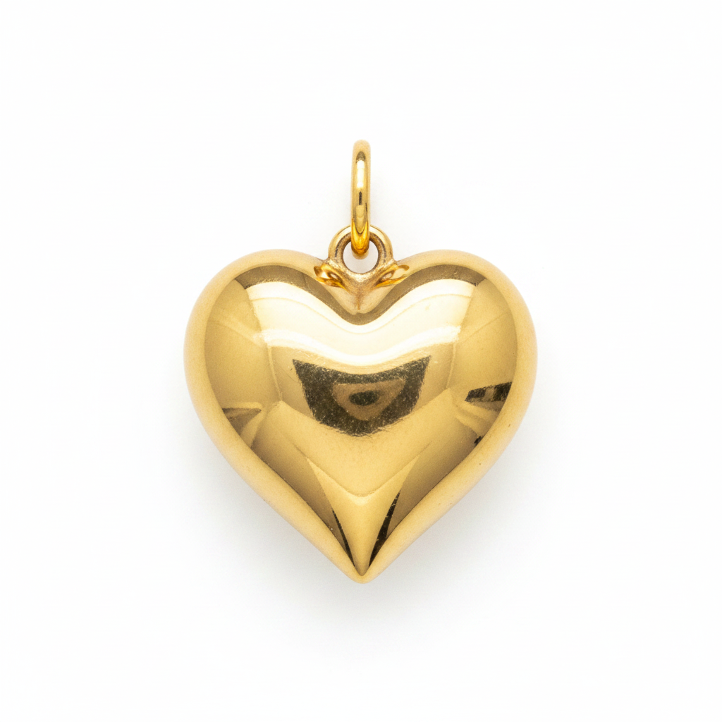 Close-up of puffy gold heart charm