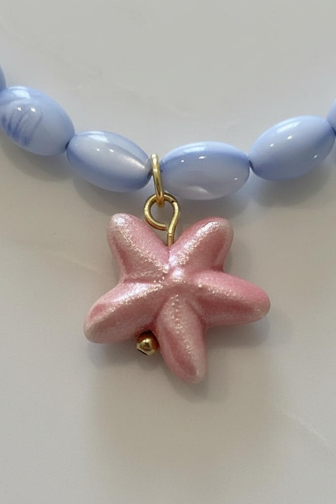 Closeup of pink starfish charm