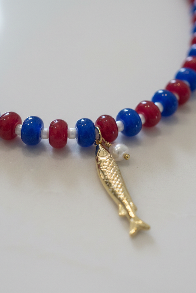 Closeup of gold fish charm