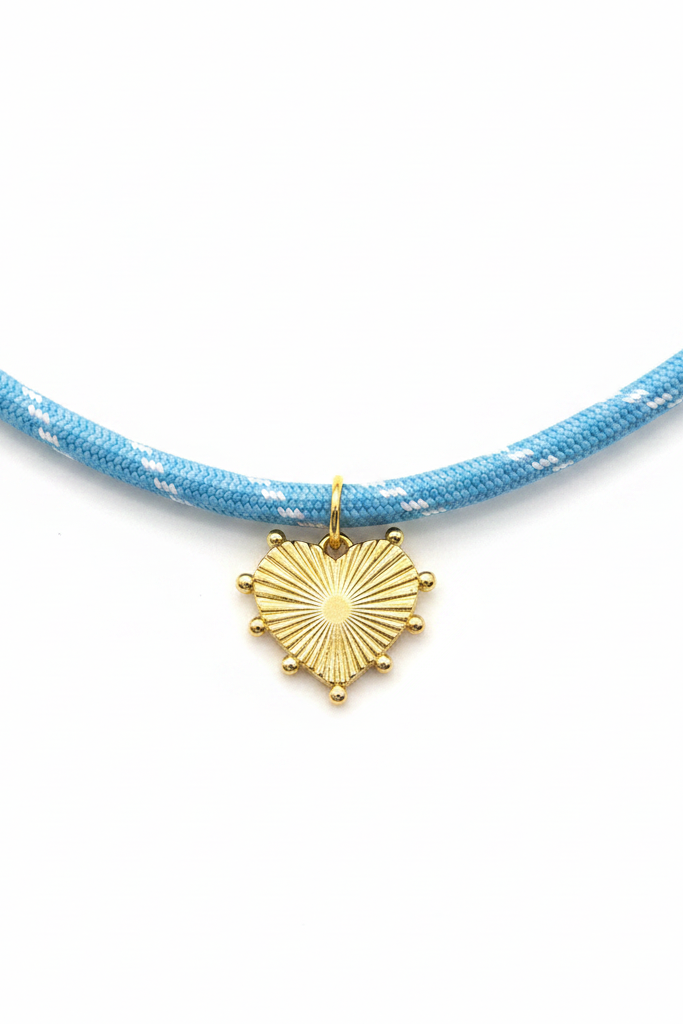Gold sunburst heart charm closeup