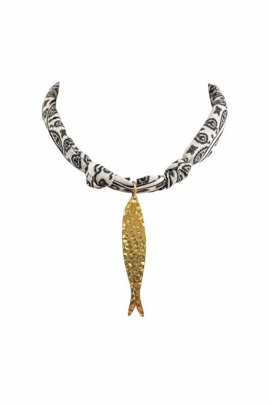Gold fish charm necklace on black and white paisley bandana